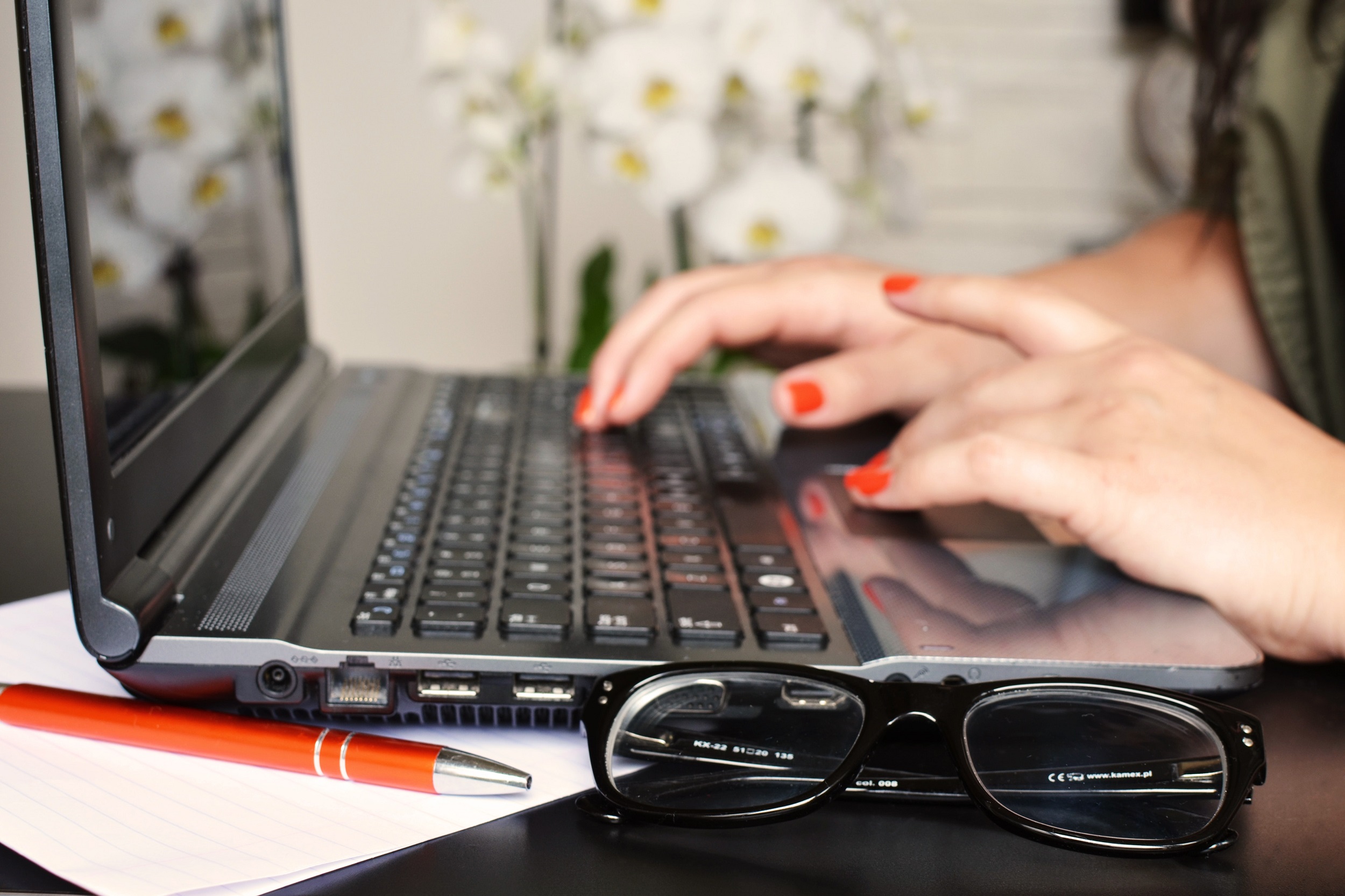 Nails typing on computer