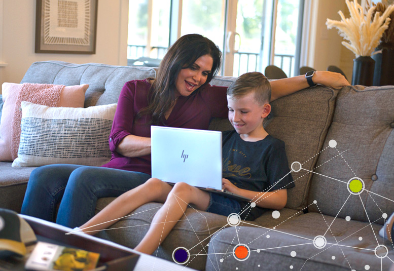 women and boy with laptop computer