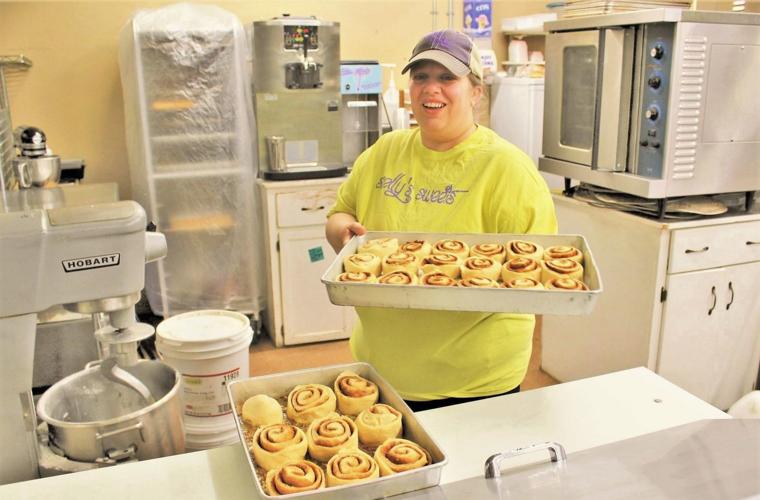 women with baking cinnamon rolls